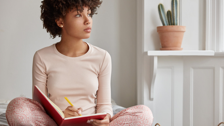 woman with journal notebook