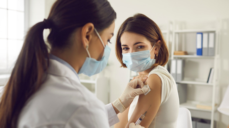 Woman getting COVID vaccine