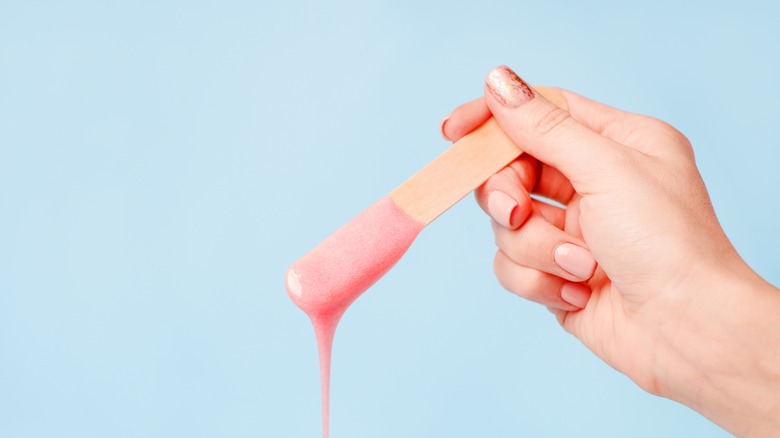 wax melting off wooden applicator 