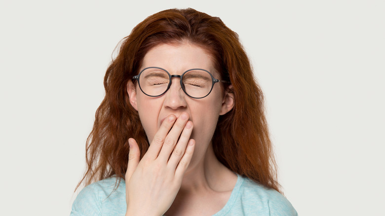 Woman yawning