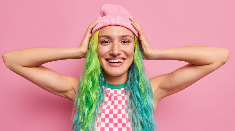 A woman with dyed hair smiling