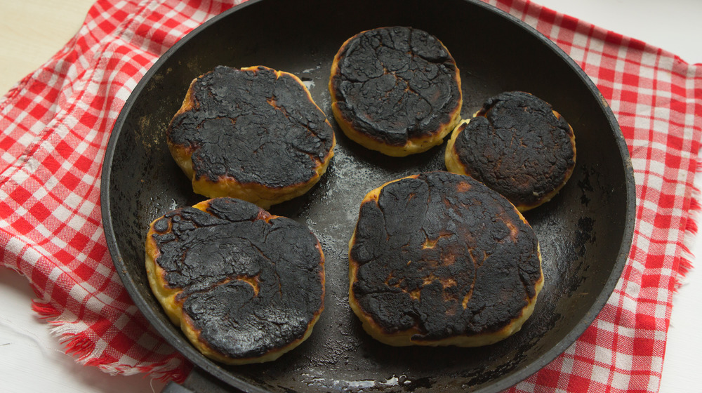 Burnt biscuits in a cast iron pan