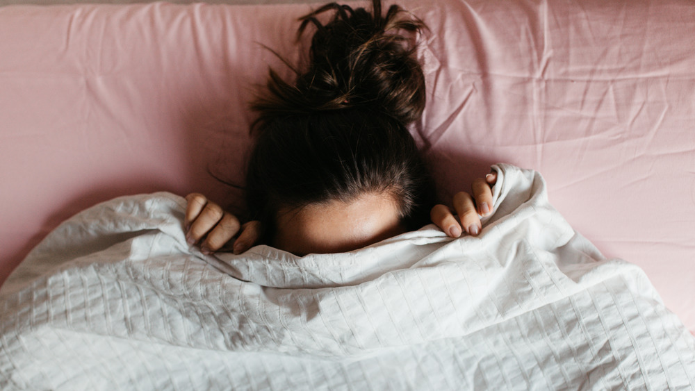 Woman struggling to sleep