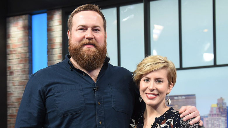 Ben and Erin Napier posing in TV studio