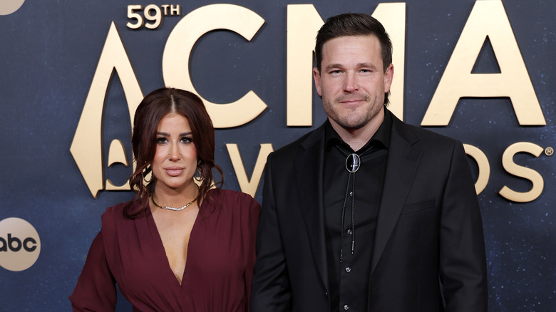 Chelsea and Cole DeBoer half-smiling in 2025