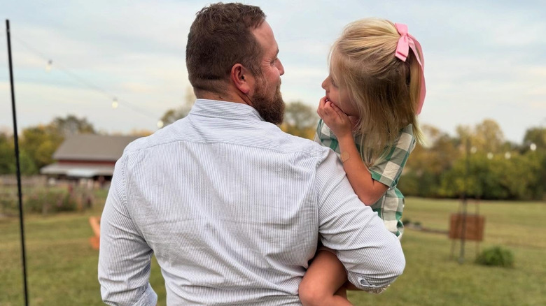 Ben Napier holding his daughter
