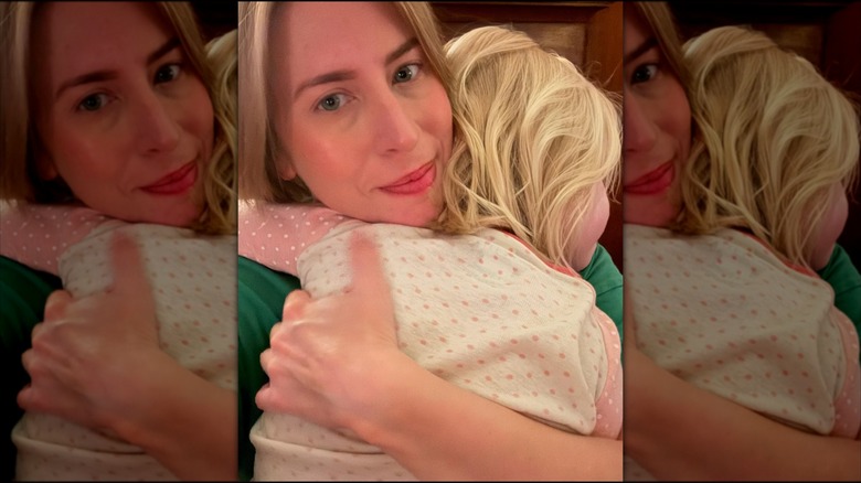 Erin Napier holding her daughter