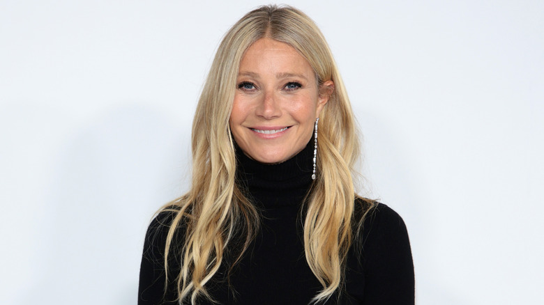 Gwyneth Paltrow smiling with white background