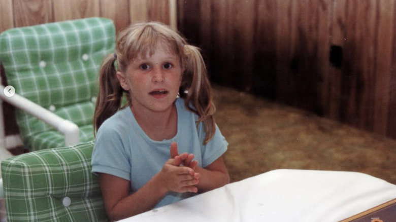 Young Jenny Marrs playing a board game