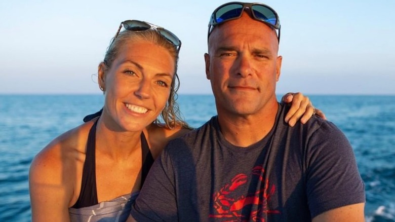 Bryan and Sarah Baeumler smiling on the water