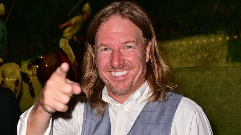 HGTV's Chip Gaines smiling and pointing