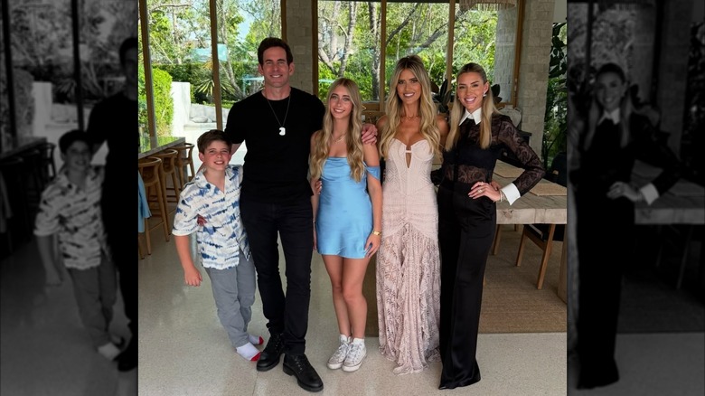 Christina Haack, Heather Rae Young, and Tarek El Moussa posing with their two children