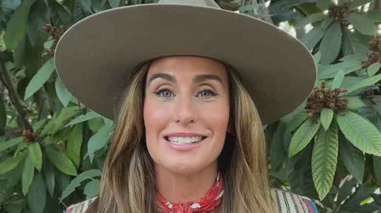 Kim Wolfe in a large hat