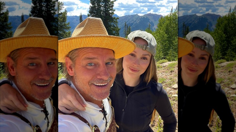 Ty Pennington smile and poses with Kellee Merrell on a mountain top.