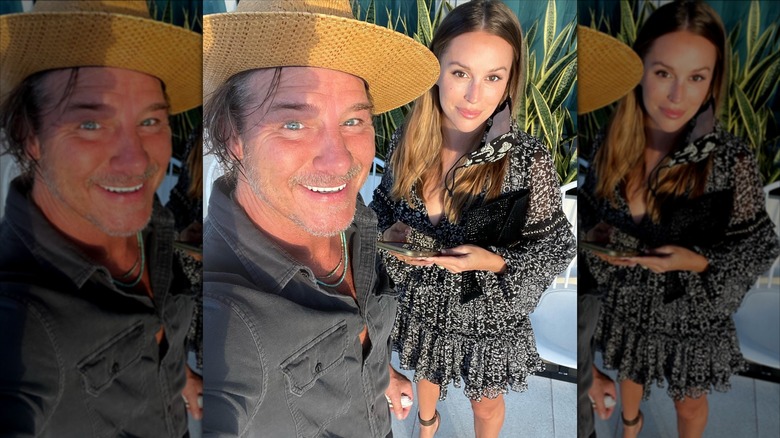 Ty Pennington and Kellee Merrell smile and pose together.