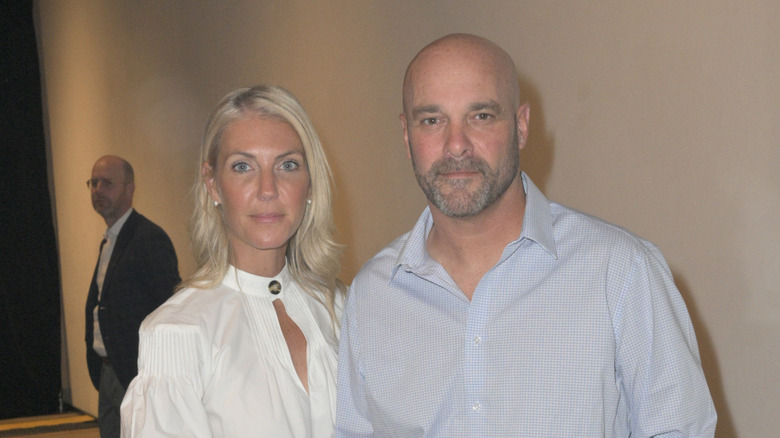 Bryan and Sarah Baeumler posing for a photo at a press conference in 2022