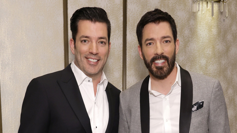 Drew (right) and Jonathan Scott (left) posing at the 2024 Critics Choice Awards