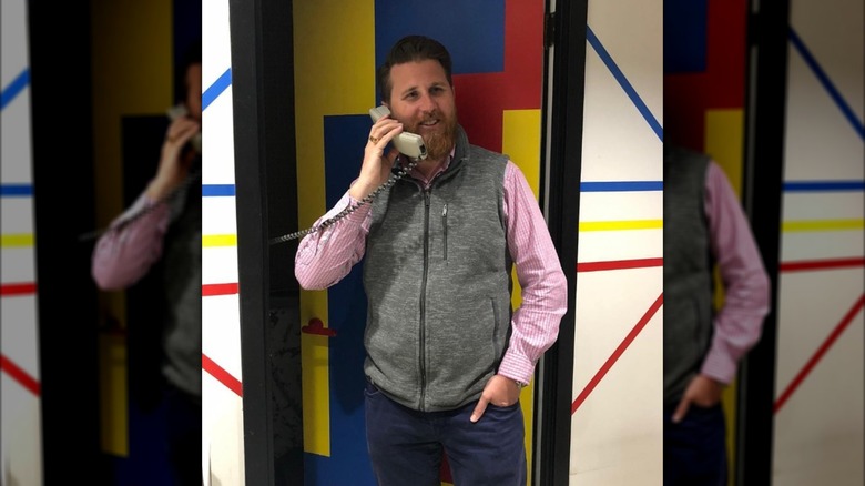 Donovon Eckhardt poses with a phone for an Instagram photo