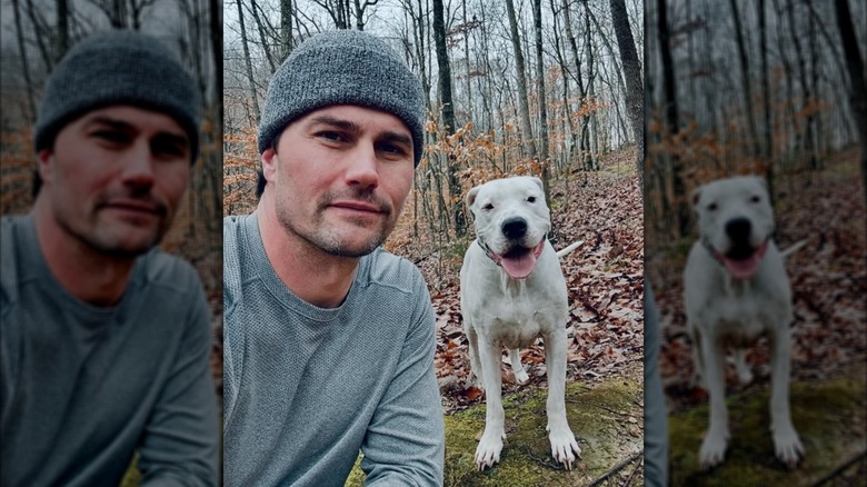 Josh Hall poses with his dog for an Instagram photo