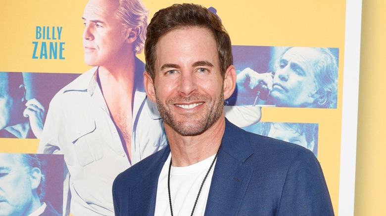 Tarek El Moussa poses on the red carpet for a Billy Zane movie
