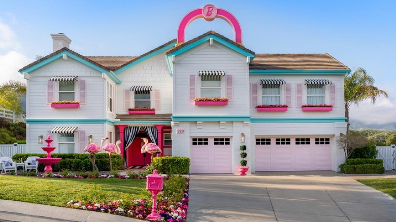 The Barbie dreamhouse in a neighborhood