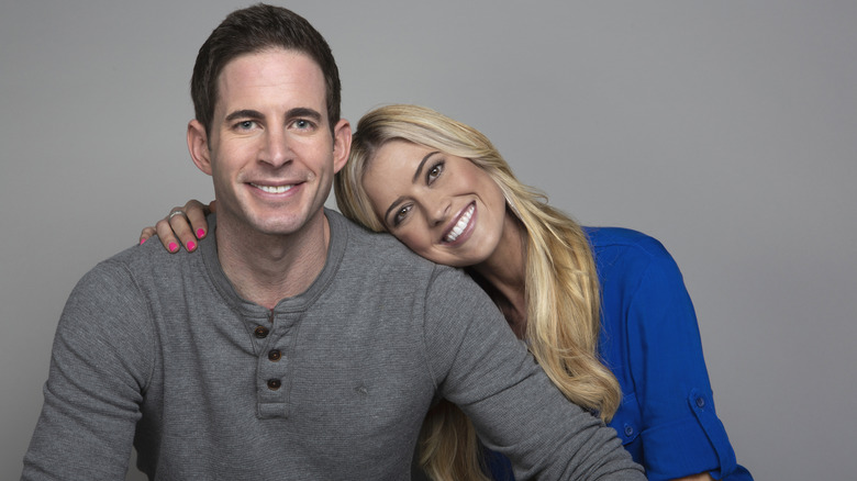 Christina Haack with her arm around Tarek El Moussa as she leans her head on his shoulder