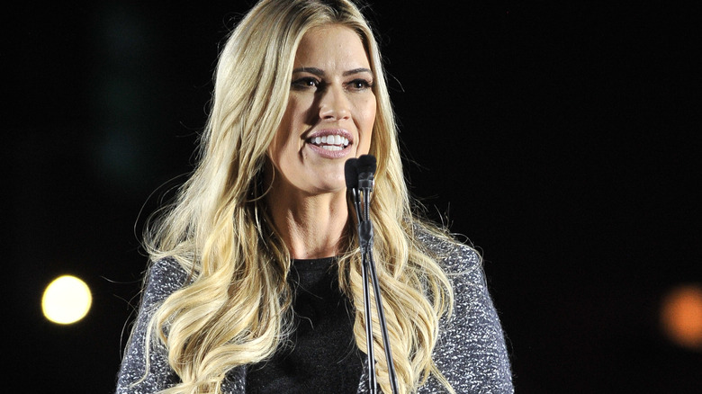 Christina Hall speaking at a microphone