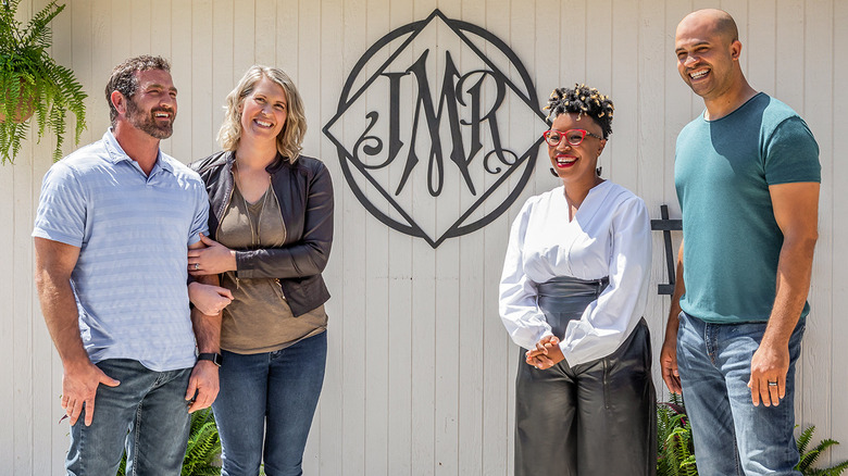 Jon Pierre and Mary Tjon-Joe-Pin with clients outside