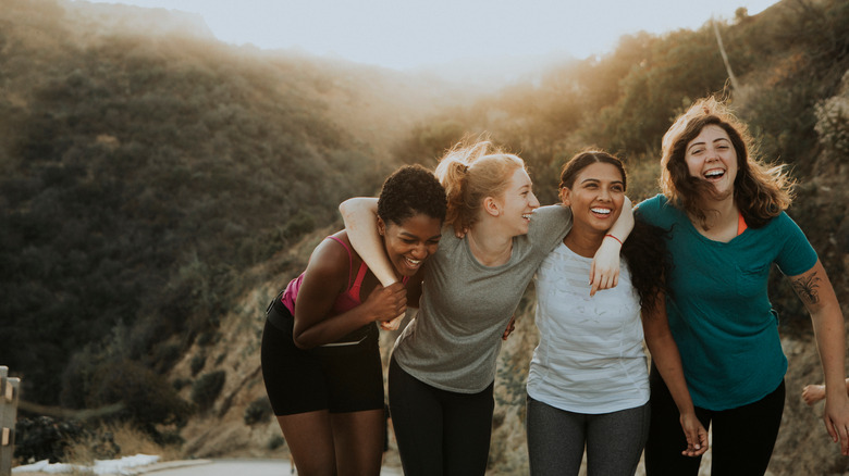 Friends laughing while hiking