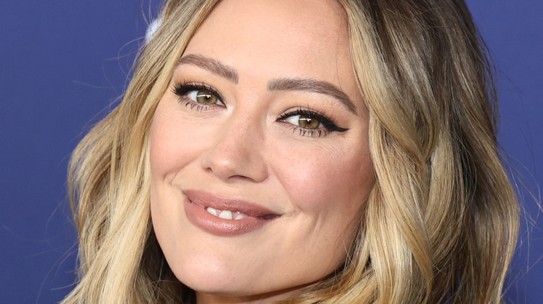 Hilary Duff smiling at an event