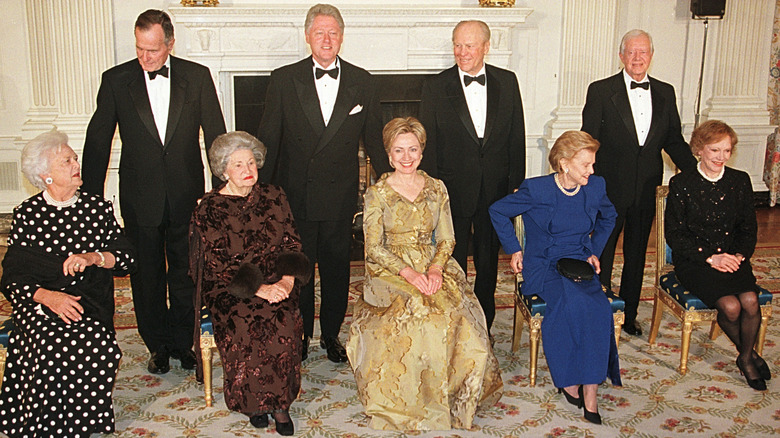 President Clinton poses with former Presidents George Bush, Gerald Ford and Jimmy Carter and first ladies, past and present, Barbara Bush, Lady Bird Johnson, Hillary Rodham Clinton, Betty Ford and Rosalynn Carter (L-R) in the State Dining Room of the White House, November 9, 2000 (2000)