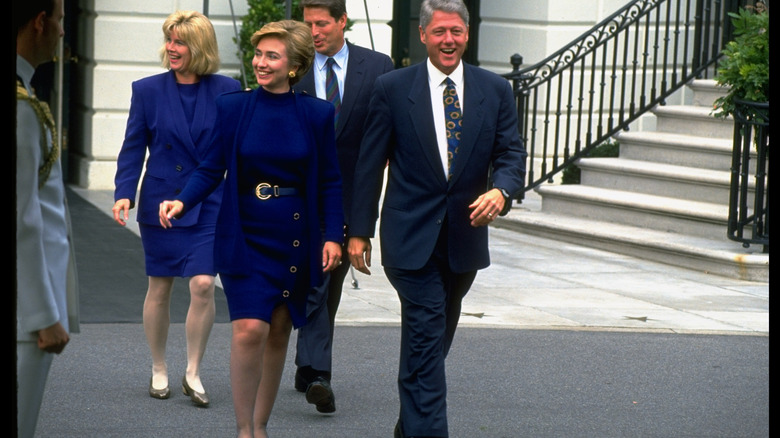 President Bill Clinton, First Lady Hillary Rodham Clinton, Vice President Al Gore, and Second Lady Tipper Gore smile as they make their way to a health care reform event on the south lawn of the White House (1993)