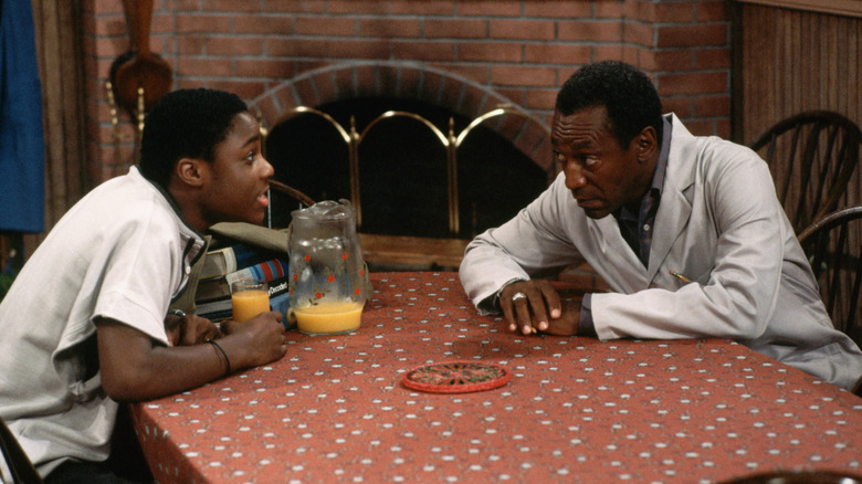Bill Cosby and Malcolm-Jamal warner filming The Cosby Show