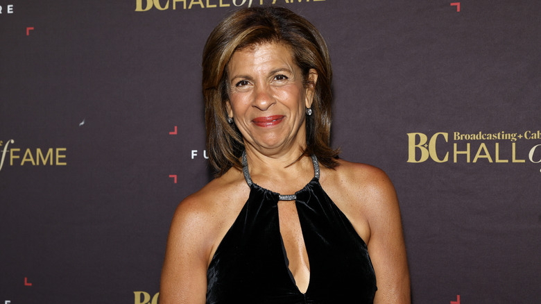 Hoda Kotb posing for photos in a black dress