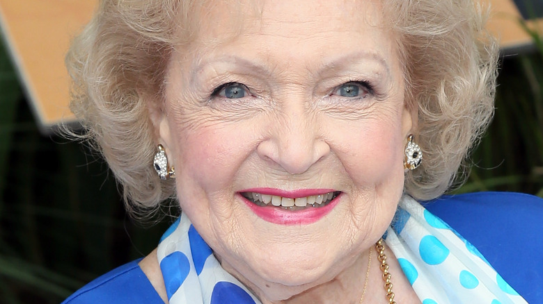 Betty White smiling wearing blue