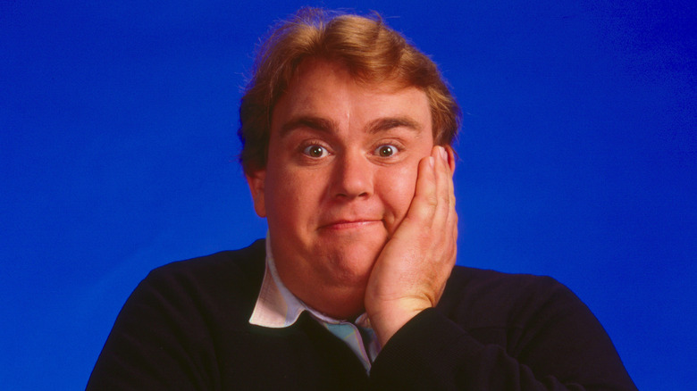 John Candy with his palm on the side of his face