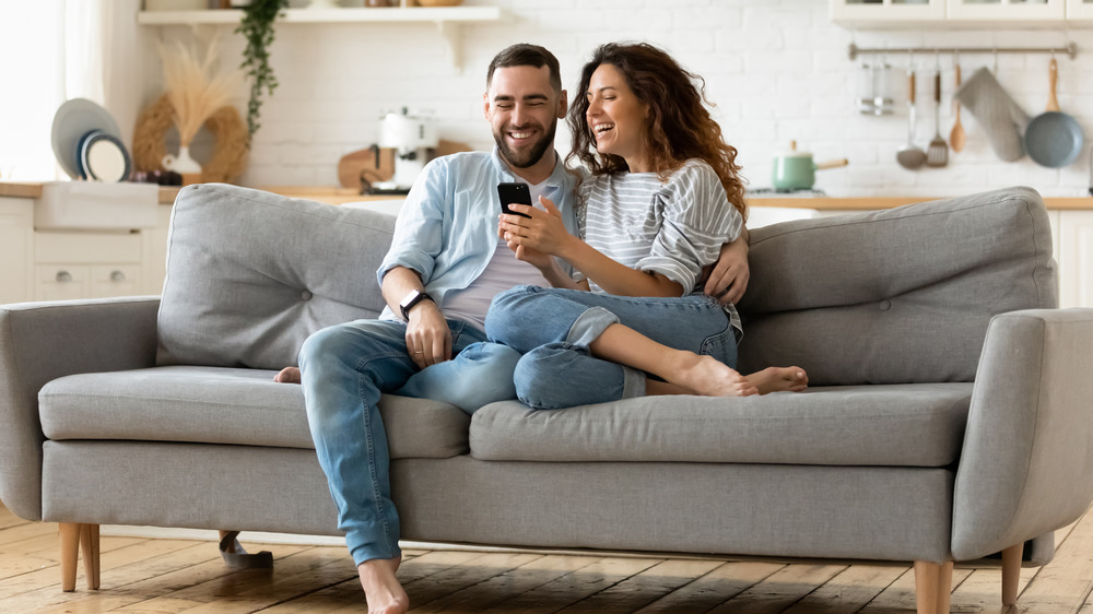 couple relaxing in cozy living room