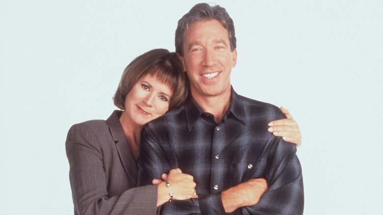 Patricia Richardson hugs Tim Allen