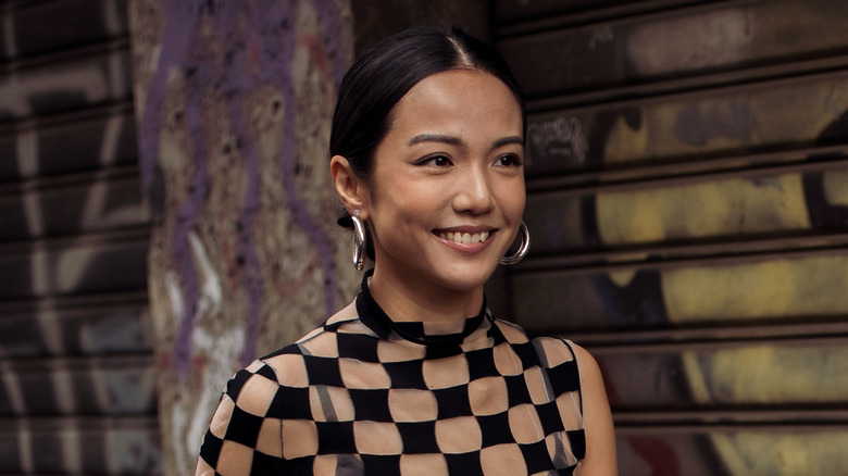 woman wearing chunky silver hoops