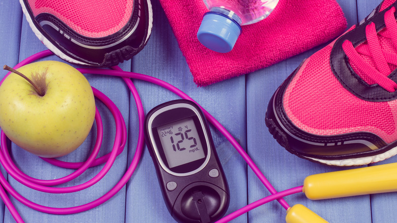 Blood sugar monitor with exercise equipment