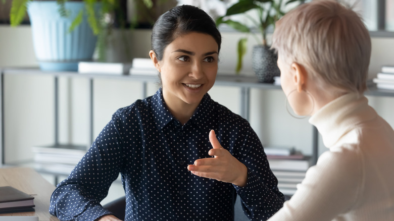 Money coach helping a client