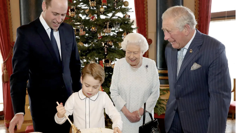 Prince George making Christmas pudding with Princes William and Charles and Queen Elizabeth