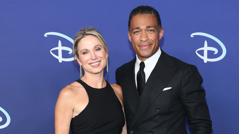 TJ Holmes and Amy Robach at a red carpet