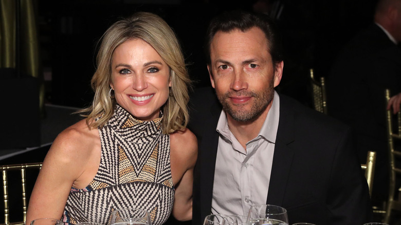 Amy Robach and Andrew Shue smiling