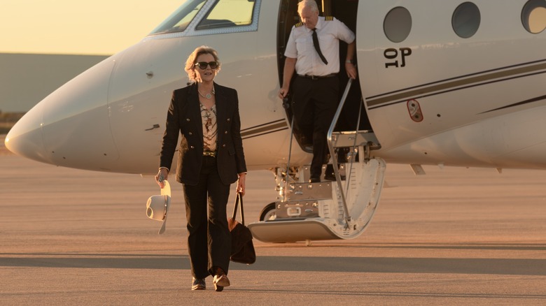 Annette Bening as Beulah Jackson walking away from a private plane