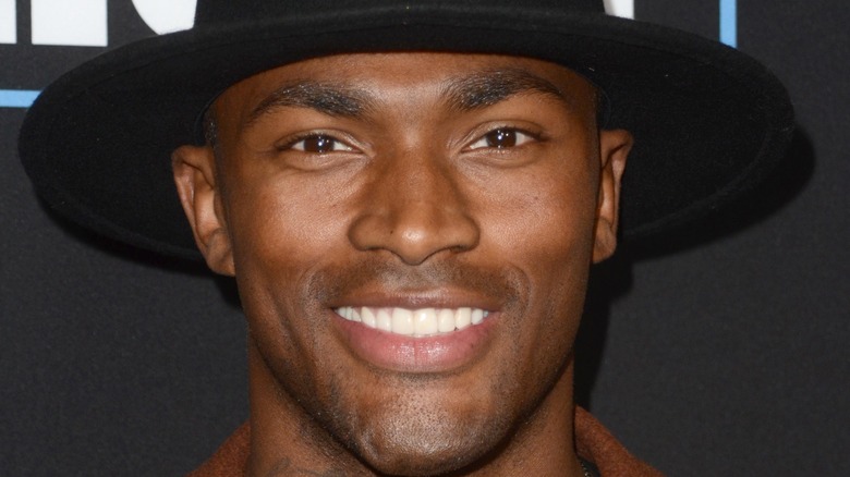 keith carlos smiling fedora