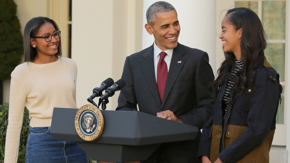 Sasha, Malia, and Barack Obama