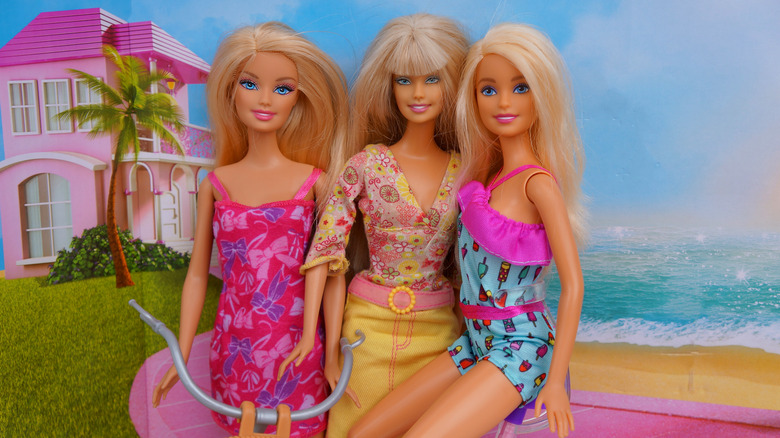 Three blonde Barbie dolls