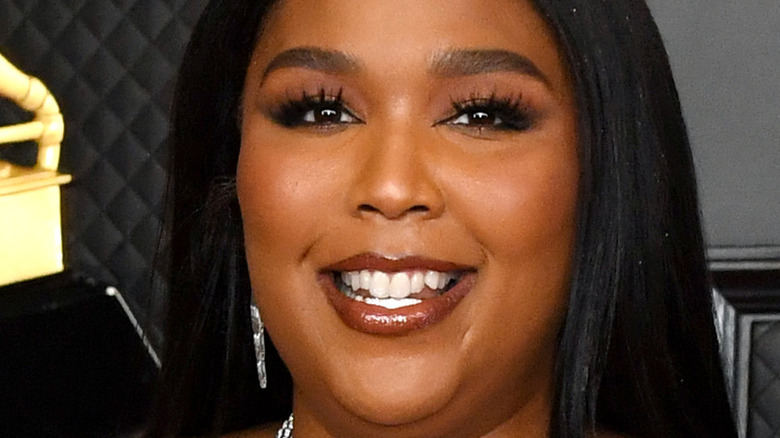 Lizzo smiling on red carpet