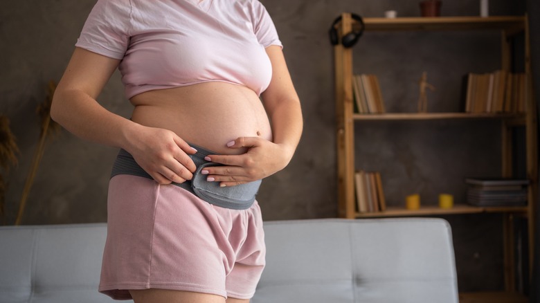 Pregnant woman wearing a pregnancy belt